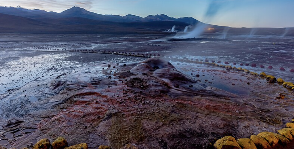 El Tatio geysers steaming at sunrise